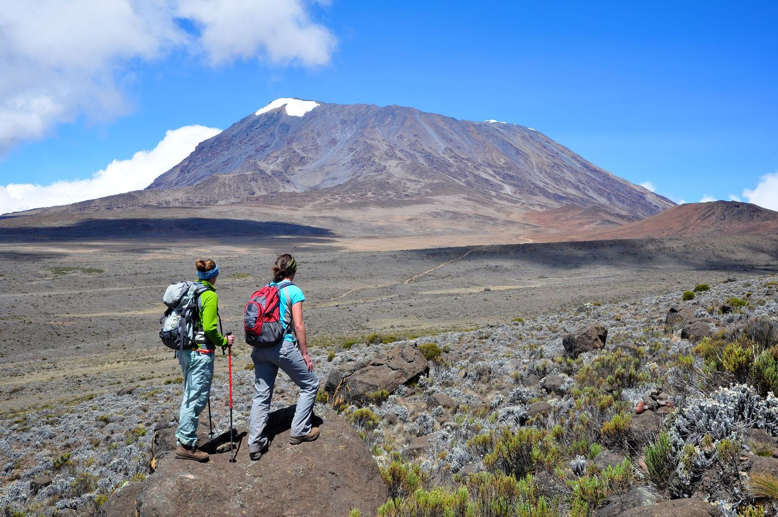 Hikers approach the upper slopes of Mount Kilimanjaro