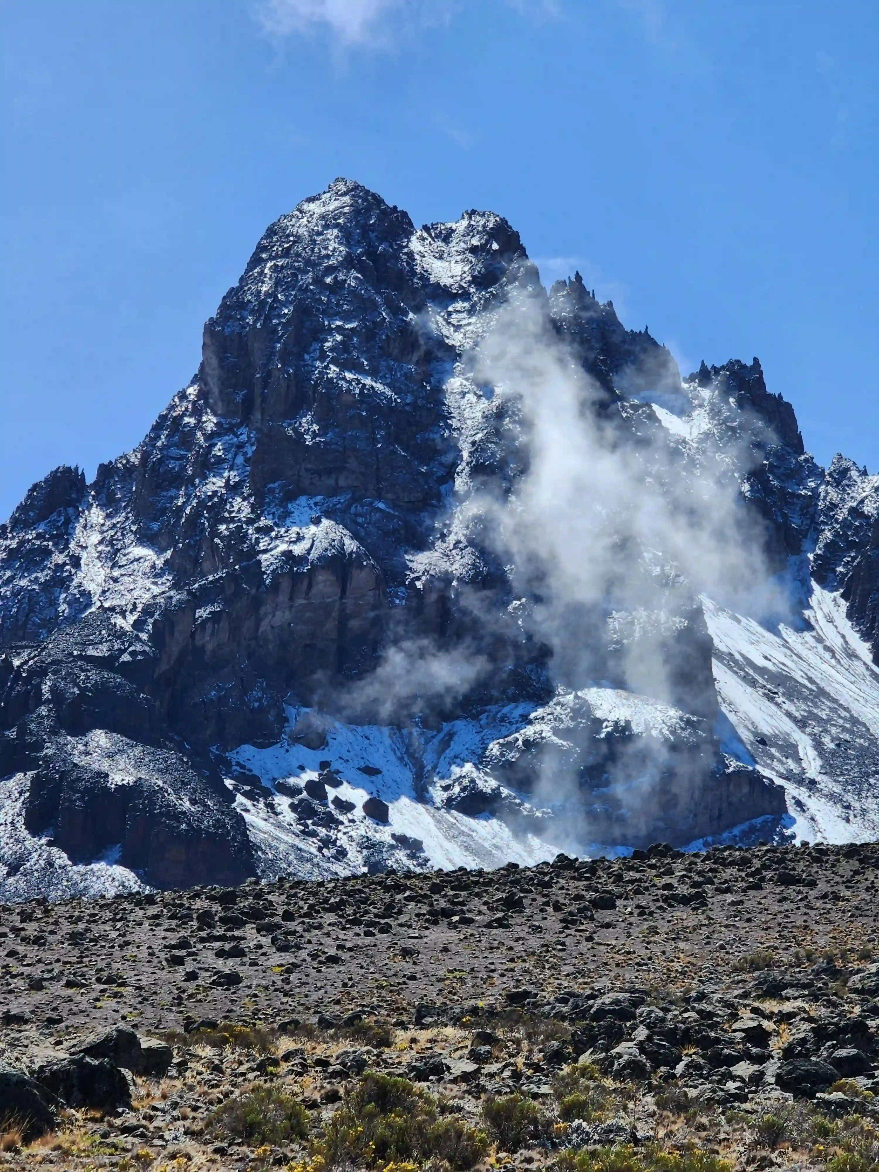 Mount Kilimanjaro rises above the surrounding landscape